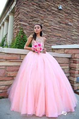 Quinceañera in blush pink dress efore being introduced to dance by DJ Lalo Flores